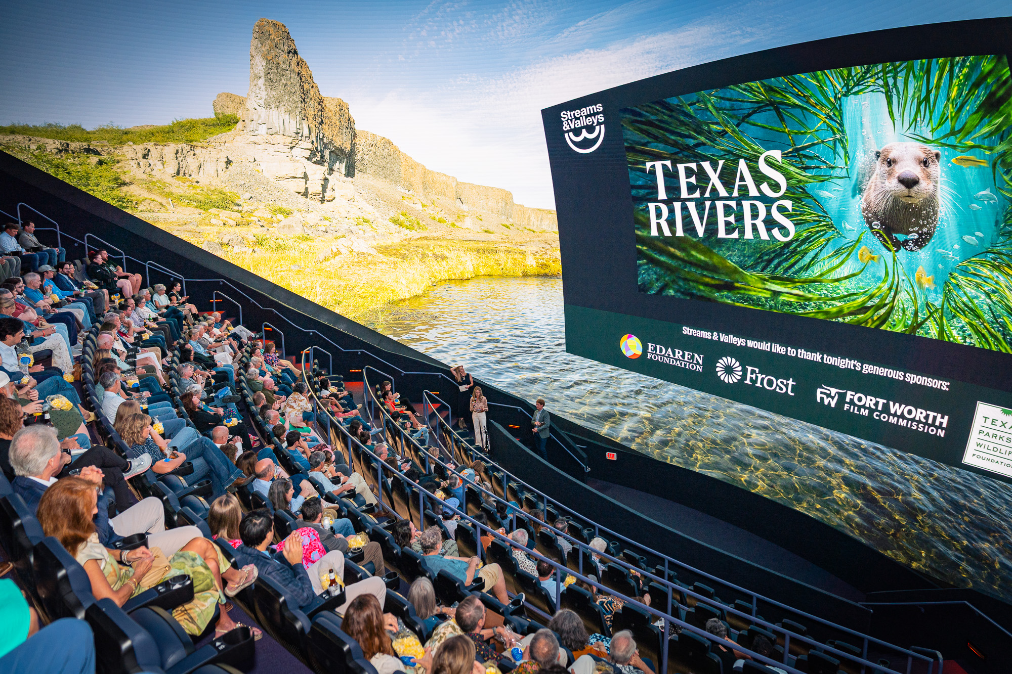 A packed Omni Theater audience watching the Texas Rivers film on the giant screen