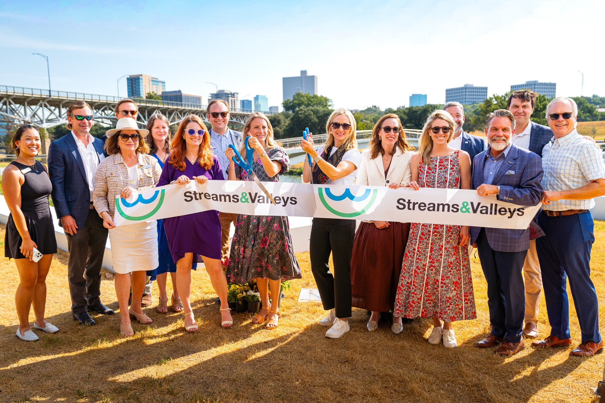 The group cutting the Streams and Valleys ribbon with the skyline behind