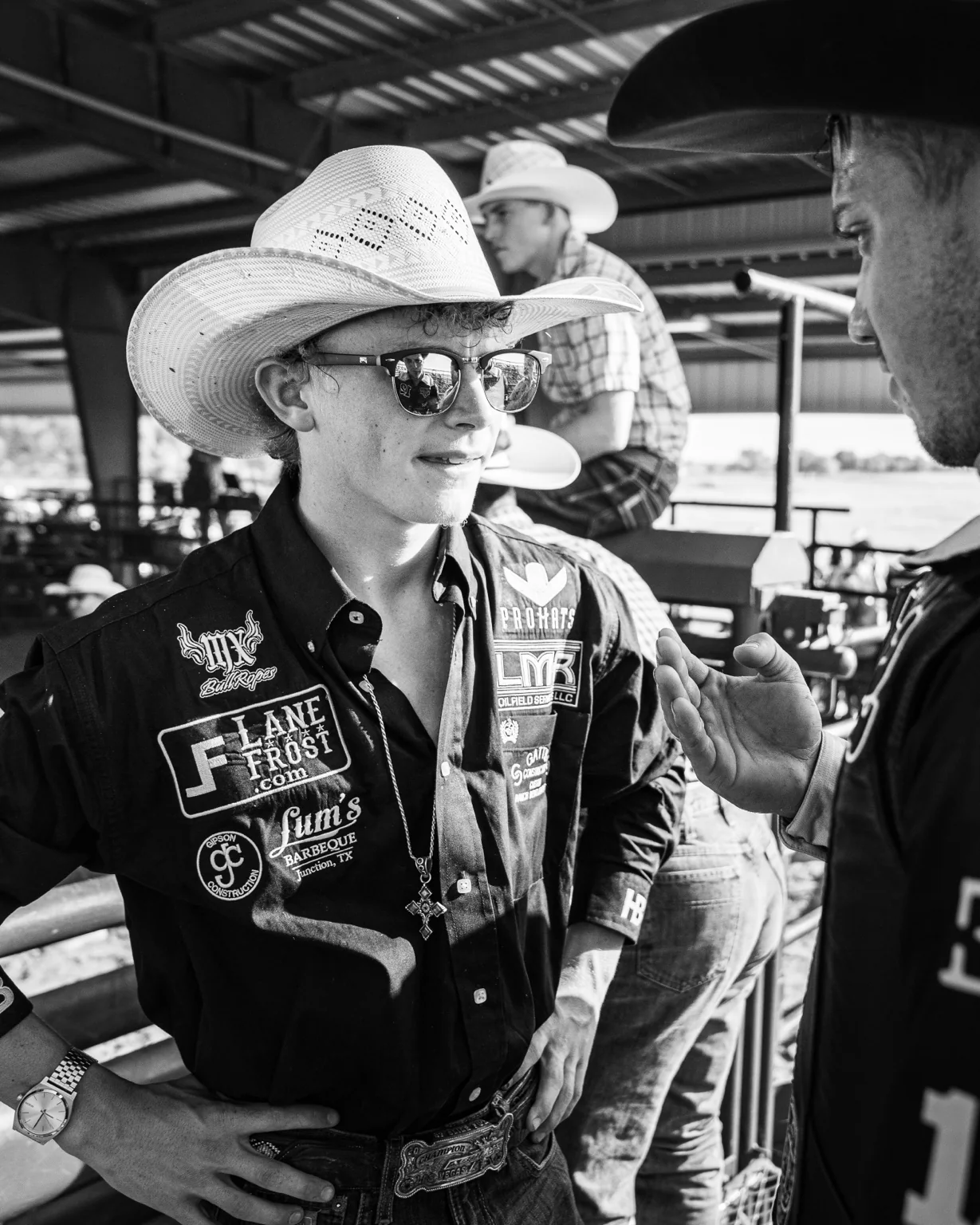 Black and white documentary photograph at a rodeo